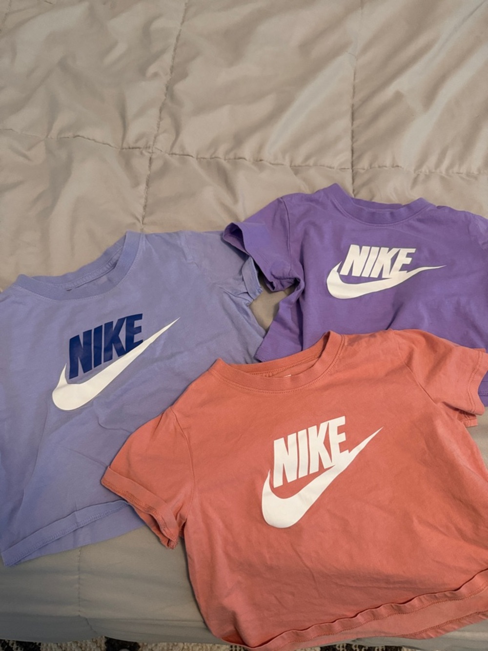 Nike Kids Short Sleeve Logo Tees in Lavender, Purple, Coral